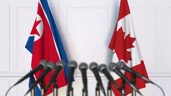 Lijst van vlaggen van Noord-Korea en Canada op internationale vergadering of conferentie. 3D-rendering — Stockfoto