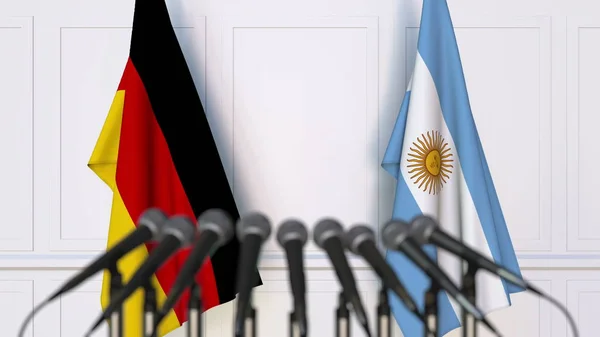 Banderas de Alemania y Argentina en reunión o conferencia internacional. Renderizado 3D — Foto de Stock