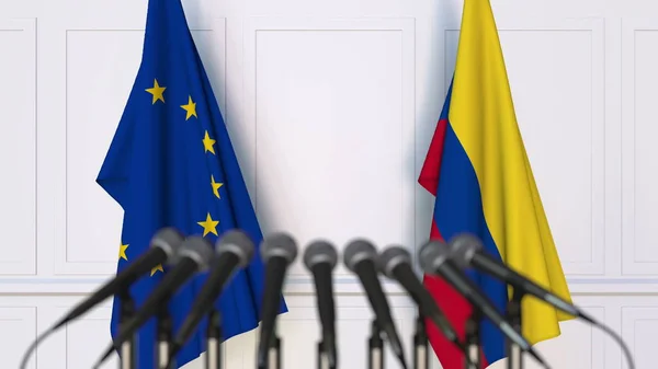 Σημαίες της Ευρωπαϊκής Ένωσης και την Κολομβία στο διεθνή σύσκεψη ή διάσκεψη. 3D rendering — Φωτογραφία Αρχείου
