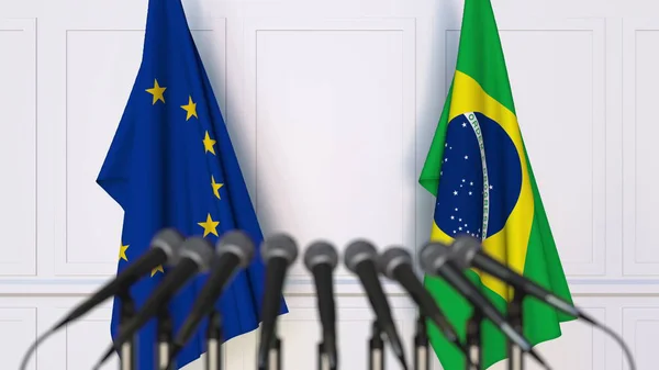 Drapeaux de l'Union européenne et du Brésil lors d'une réunion ou d'une conférence internationale. rendu 3D — Photo