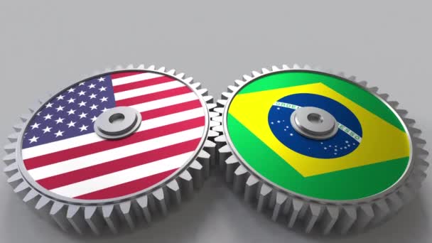 Флаги США и Бразилии на сетчатых передачах. Концептуальная анимация международного сотрудничества — стоковое видео