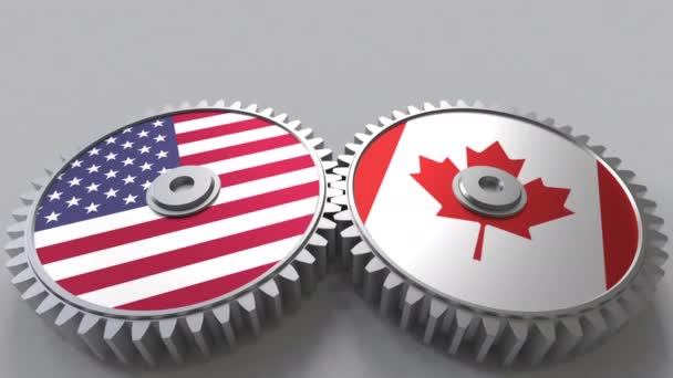 Flaggen der USA und Kanadas auf ineinander greifenden Zahnrädern. Konzeptionelle Animation der internationalen Zusammenarbeit — Stockvideo