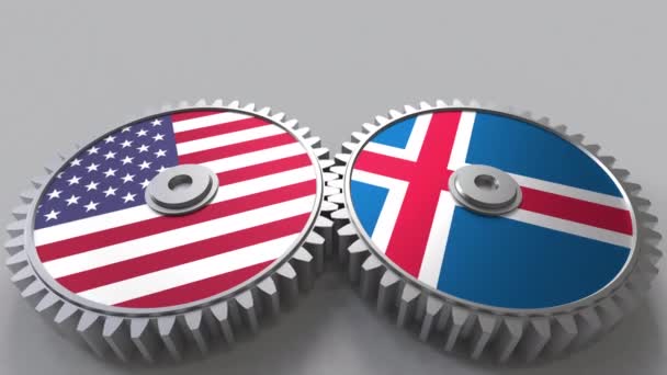 Flaggen der USA und Islands auf ineinander greifenden Zahnrädern. Konzeptionelle Animation der internationalen Zusammenarbeit — Stockvideo