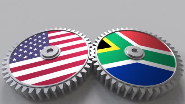 Flaggor av Usa och Sydafrika på Meshning gears. Internationellt samarbete konceptuella animation — Stockvideo