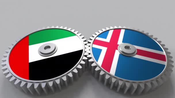 Bandeiras dos Emirados Árabes Unidos e Islândia em engrenagens de malha. Cooperação internacional animação conceitual — Vídeo de Stock