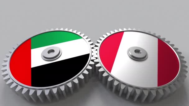 Bandiere degli Emirati Arabi Uniti e del Perù su ingranaggi a maglie. Cooperazione internazionale animazione concettuale — Video Stock