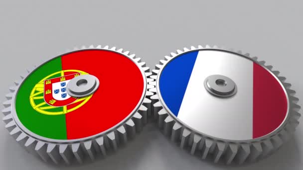 Flags of Portugal and France on meshing gears. International cooperation conceptual animation — Stock Video