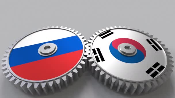 歯車のかみあいにロシアと韓国のフラグです。国際協力の概念のアニメーション — ストック動画