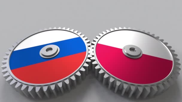 Banderas de Rusia y Polonia en engranajes de malla. Cooperación internacional animación conceptual — Vídeos de Stock