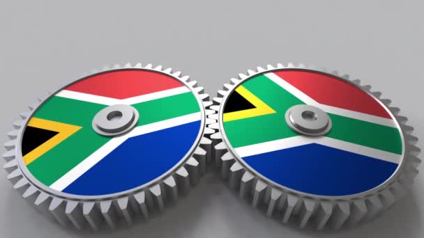 SAR national project. Flags of South Africa on moving cogwheels. Conceptual animation — Stock Video