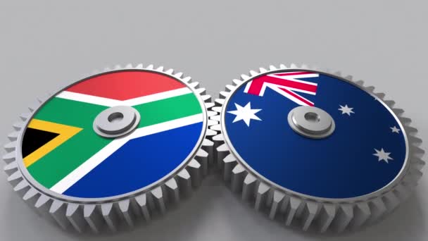 Banderas de Sudáfrica y Australia en engranajes de malla. Cooperación internacional animación conceptual — Vídeos de Stock