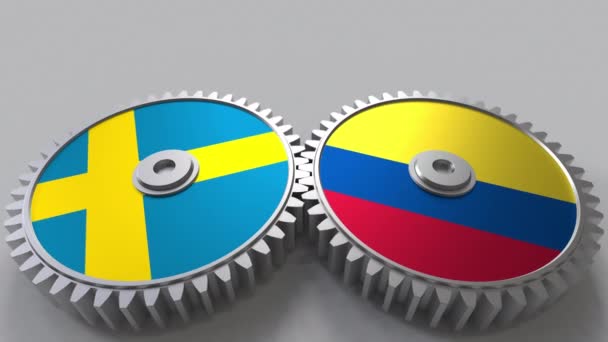 Banderas de Suecia y Colombia en engranajes de malla. Cooperación internacional animación conceptual — Vídeos de Stock