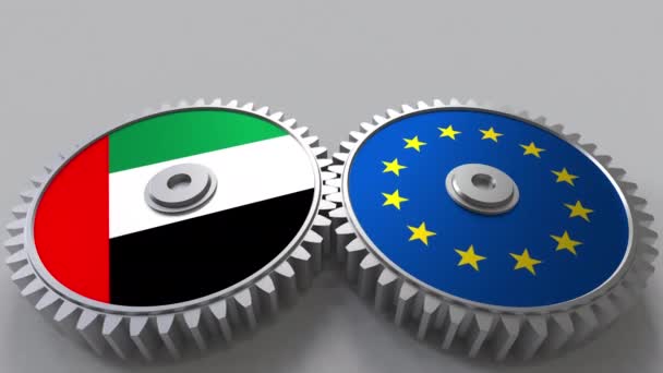 Flaggor av Uae och Europeiska unionen på Meshning gears. Internationellt samarbete konceptuella animation — Stockvideo