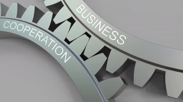 BUSINESS COOPERATION caption on meshing gears. Conceptual animation — Stock Video