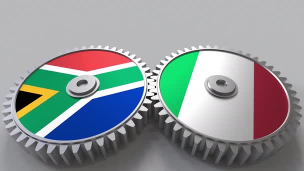 Bandiere del Sudafrica e dell'Italia su ingranaggi a maglie. Cooperazione internazionale animazione concettuale — Video Stock