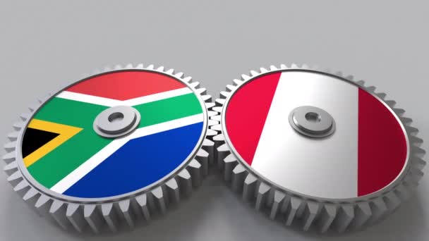 Flaggor i Sydafrika och Peru på Meshning gears. Internationellt samarbete konceptuella animation — Stockvideo