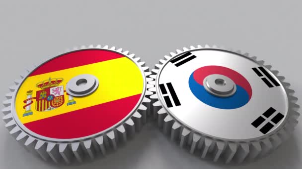 Příznaky ze Španělska a Koreje na záběru ozubených kol. Mezinárodní spolupráce koncepční animace — Stock video