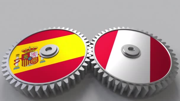 Flaggor i Spanien och Peru på Meshning gears. Internationellt samarbete konceptuella animation — Stockvideo