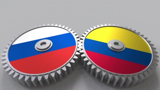 Banderas de Rusia y Colombia en engranajes de malla. Cooperación internacional animación conceptual — Vídeos de Stock