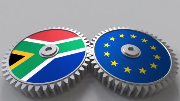 Lijst van vlaggen van Zuid-Afrika en de Europese Unie over het weven van de versnellingen. Internationale samenwerking conceptuele animatie — Stockvideo