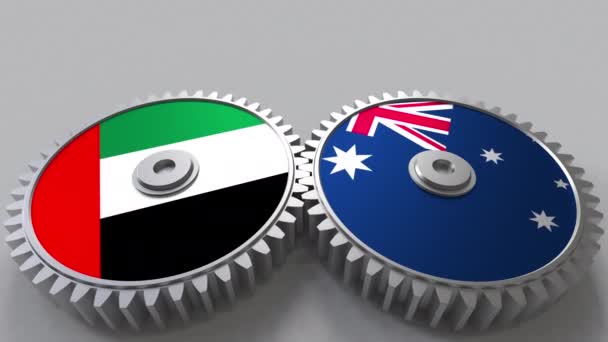 Bandiere degli Emirati Arabi Uniti e dell'Australia su ingranaggi a maglie. Cooperazione internazionale animazione concettuale — Video Stock