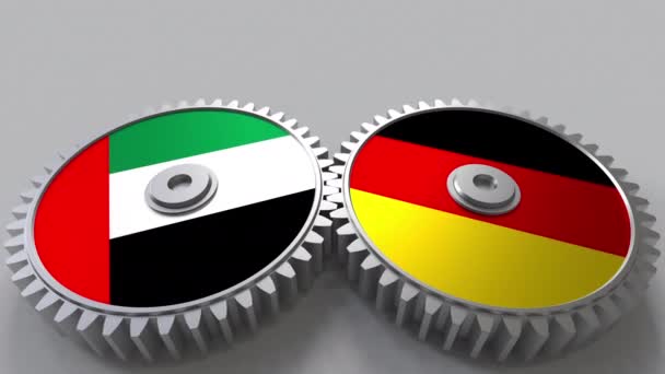 Flags of the UAE and Germany on meshing gears. International cooperation conceptual animation — Stock Video