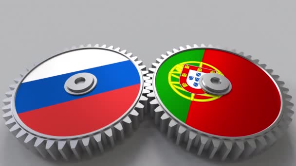 Banderas de Rusia y Portugal en engranajes de malla. Cooperación internacional animación conceptual — Vídeo de stock