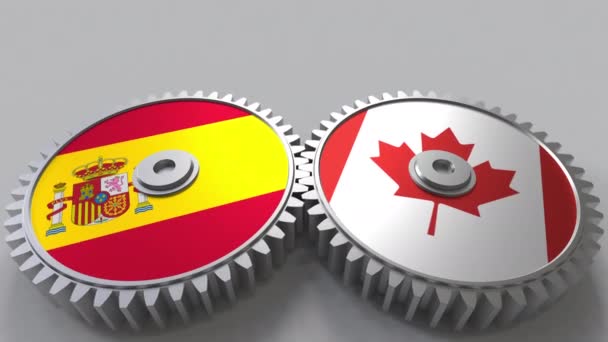 西班牙和加拿大在啮合齿轮上的旗帜。国际合作概念动画 — 图库视频影像
