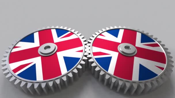 Proyecto nacional británico. Banderas del Reino Unido sobre ruedas dentadas en movimiento. Animación conceptual — Vídeos de Stock