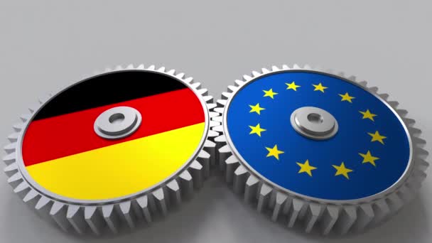 Banderas de Alemania y de la Unión Europea sobre engranajes de malla. Cooperación internacional animación conceptual — Vídeos de Stock