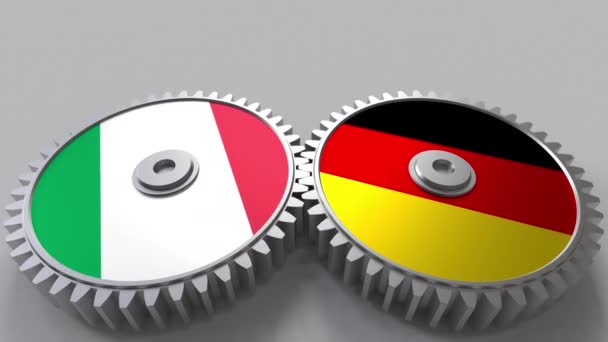 Flags of Italy and Germany on meshing gears. International cooperation conceptual animation — Stock Video