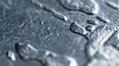 Scratched surface of an old coin. Super macro shot clipart