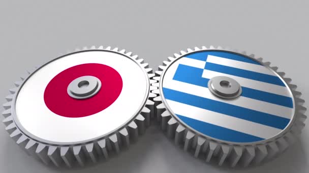 Banderas de Japón y Grecia en engranajes de malla. Cooperación internacional animación conceptual — Vídeo de stock