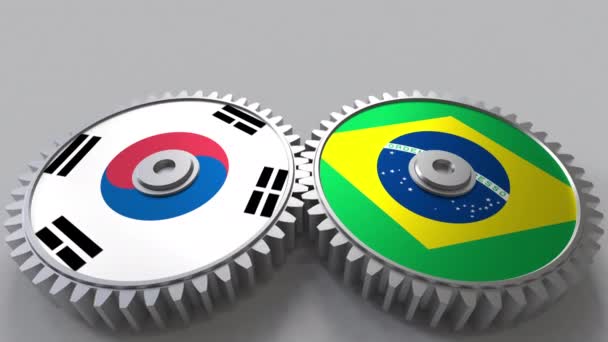 Lijst van vlaggen van Zuid-Korea en Brazilië op het weven van de versnellingen. Internationale samenwerking conceptuele animatie — Stockvideo
