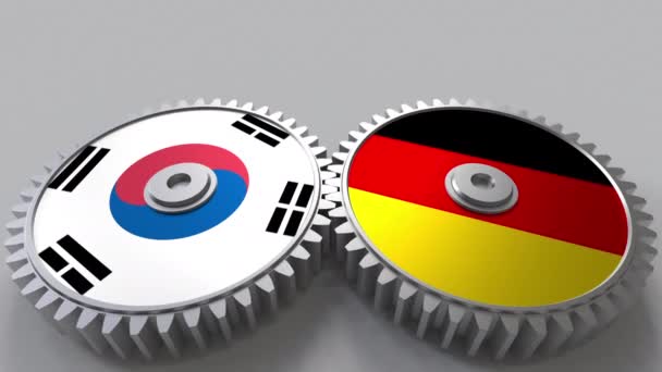 韩国和德国在啮合齿轮上的旗帜。国际合作概念动画 — 图库视频影像