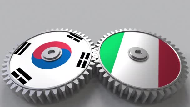 Flaggor i Sydkorea och Italien på Meshning gears. Internationellt samarbete konceptuella animation — Stockvideo