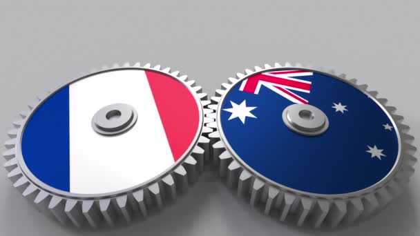 Banderas de Francia y Australia en engranajes de malla. Cooperación internacional animación conceptual — Vídeo de stock