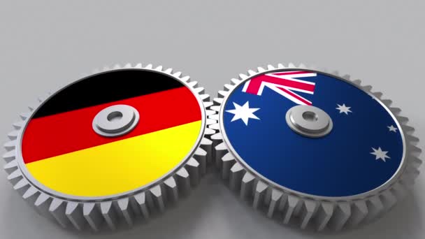 Drapeaux de l'Allemagne et de l'Australie sur les engrenages. Coopération internationale animation conceptuelle — Video