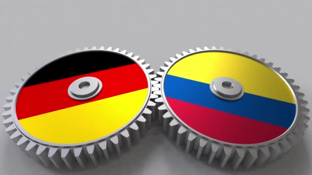 Flags of Germany and Colombia on meshing gears. International cooperation conceptual animation — Stock Video