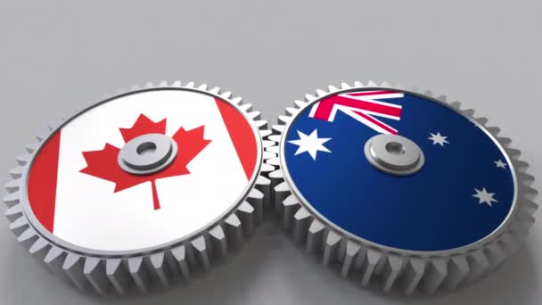 Flaggen Kanadas und Australiens auf ineinandergreifenden Zahnrädern. Konzeptionelle Animation der internationalen Zusammenarbeit — Stockvideo