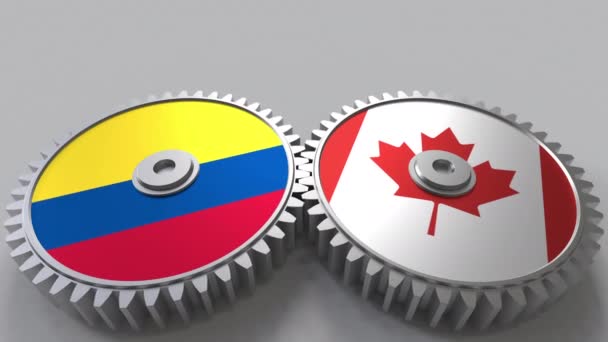 Bandiere della Colombia e del Canada su ingranaggi a maglie. Cooperazione internazionale animazione concettuale — Video Stock