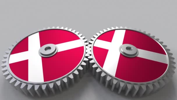 Danish national project. Flags of Denmark on moving cogwheels. Conceptual animation — Stock Video