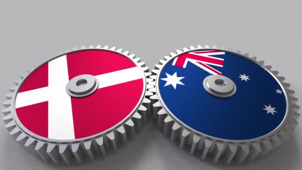 Banderas de Dinamarca y Australia en engranajes de malla. Cooperación internacional animación conceptual — Vídeo de stock