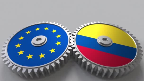 Flags of the European Union and Colombia on meshing gears. International cooperation conceptual animation — Stock Video