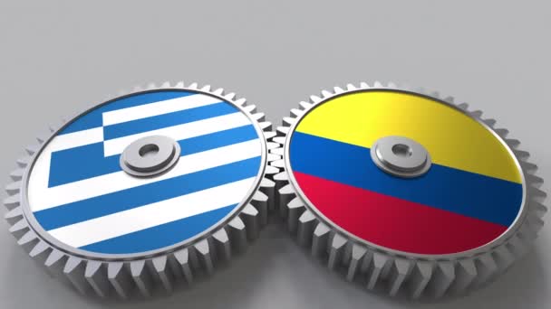 Banderas de Grecia y Colombia en engranajes de malla. Cooperación internacional animación conceptual — Vídeo de stock