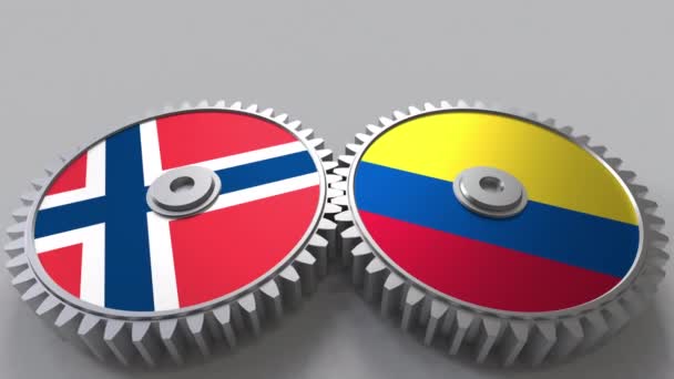 Vlajkami Norska a Kolumbie na záběru ozubených kol. Mezinárodní spolupráce koncepční animace — Stock video