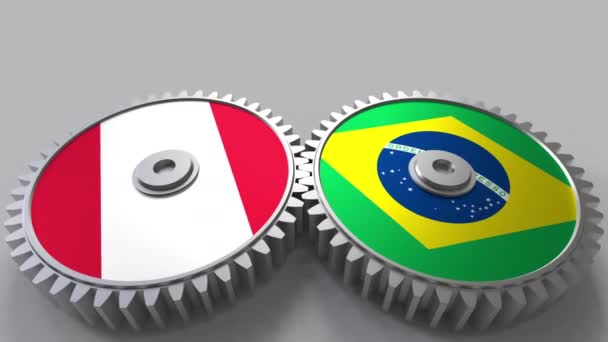 Flags of Peru and Brazil on meshing gears. International cooperation conceptual animation — Stock Video