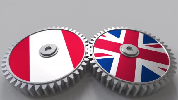Flags of Peru and The United Kingdom on meshing gears. International cooperation conceptual animation — Stock Video