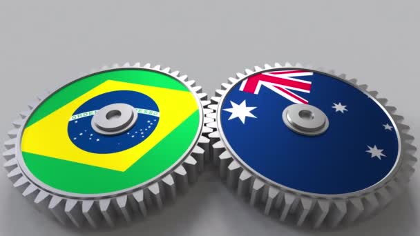 Flags of Brazil and Australia on meshing gears. International cooperation conceptual animation — Stock Video