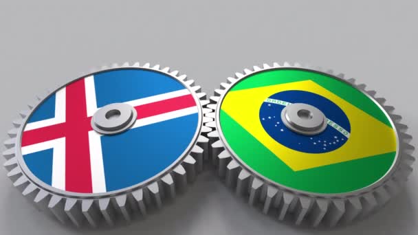 Flags of Iceland and Brazil on meshing gears. International cooperation conceptual animation — Stock Video